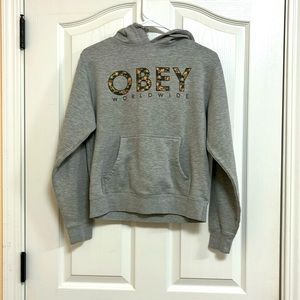 I’m selling a gray hoodie with wording on the front.